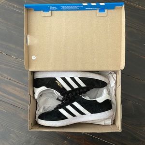 slightly worn adidas gazelles in black suede.